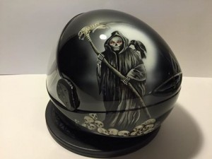 “Grim Reaper” (Cookie G3 Helmet, Owner: Billy Heerdt, 2016) "This piece is one of my favorites not only because it includes bones and skulls and dark subject matter, but because this helmet was the start to my relationship with the most important man in my life," Marissa details. "He approached me about doing some artwork on his helmet and after a few meetings, we began dating and developed a wonderful relationship. He’s been so supportive of me and my business, I couldn’t ask for a better significant other."