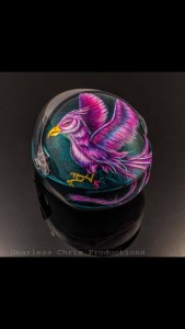 “Teal and Pink Phoenix” (KISS Helmet, Owner: Sarah Hernandez, 2015) "This helmet was one of the first truly intricate and challenging pieces I have created," Marissa says. "I did a three step process with a teal marble-effect on the helmet. Then the phoenix is all painted by hand with acrylics. It took me about 50 hours to complete, but Sarah and I were both incredibly happy with the end result."